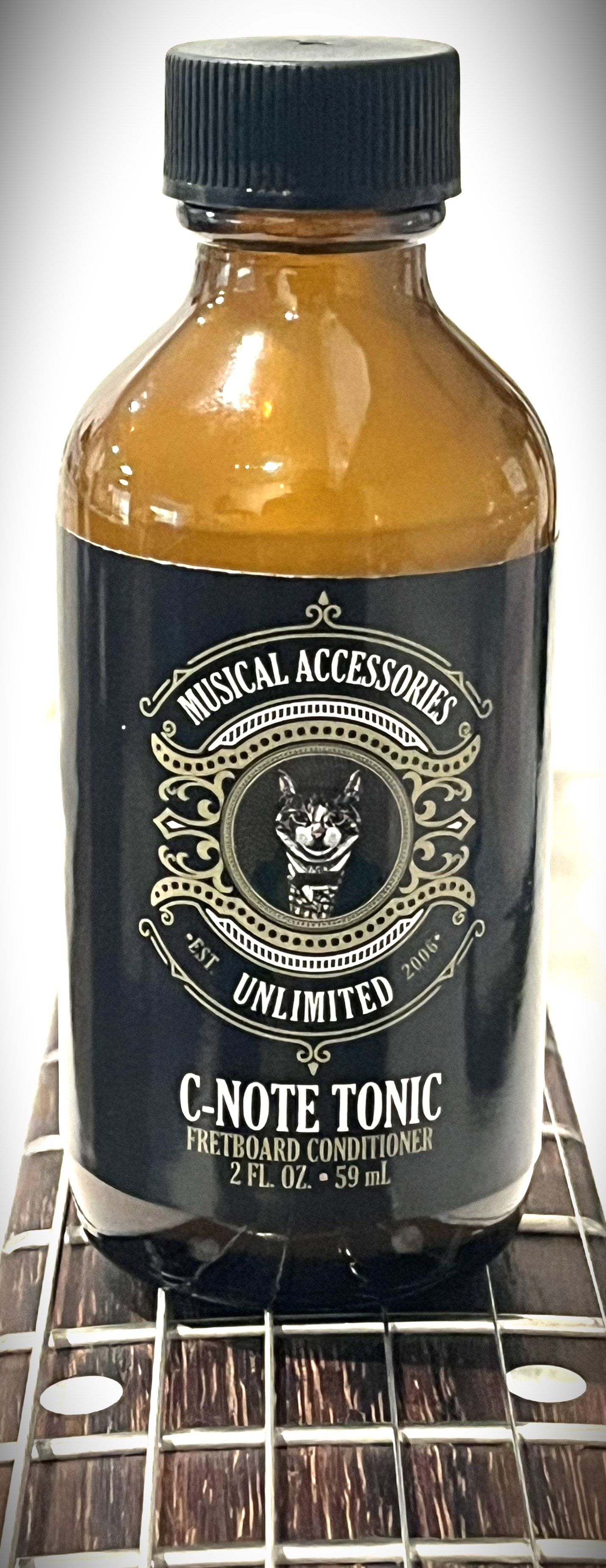C-Note Tonic bottle on guitar neck